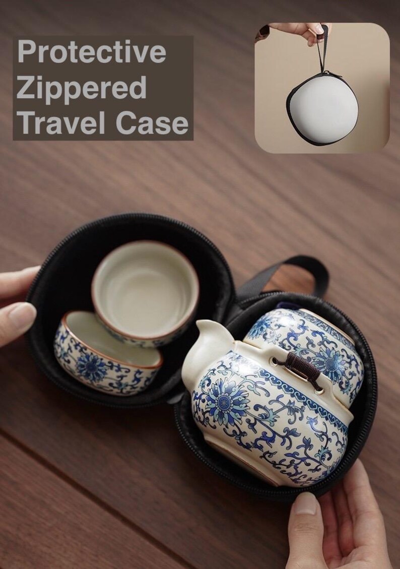 May include: A black zippered travel case containing a small tea set. The tea set includes a teapot and two cups, all decorated with blue floral patterns. The text "Protective Zippered Travel Case" is visible.