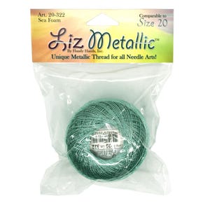 May include: A ball of sea foam green Liz Metallic thread, size 20, in a clear plastic package. The label reads "Unique Metallic Thread for all Needle Arts!"