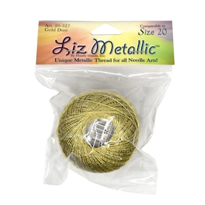 May include: A ball of gold metallic thread, packaged in a clear plastic bag. The label reads "Liz Metallic" and "Unique Metallic Thread for all Needle Arts!" The thread is labeled "Gold Dust" and "Size 20".