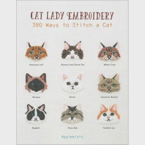 May include: A book cover with the title "CAT LADY EMBROIDERY" and the subtitle "380 Ways to Stitch a Cat." It features embroidered cat faces, each labeled with a breed name, including American Curl, Ragdoll, and Turkish Van.