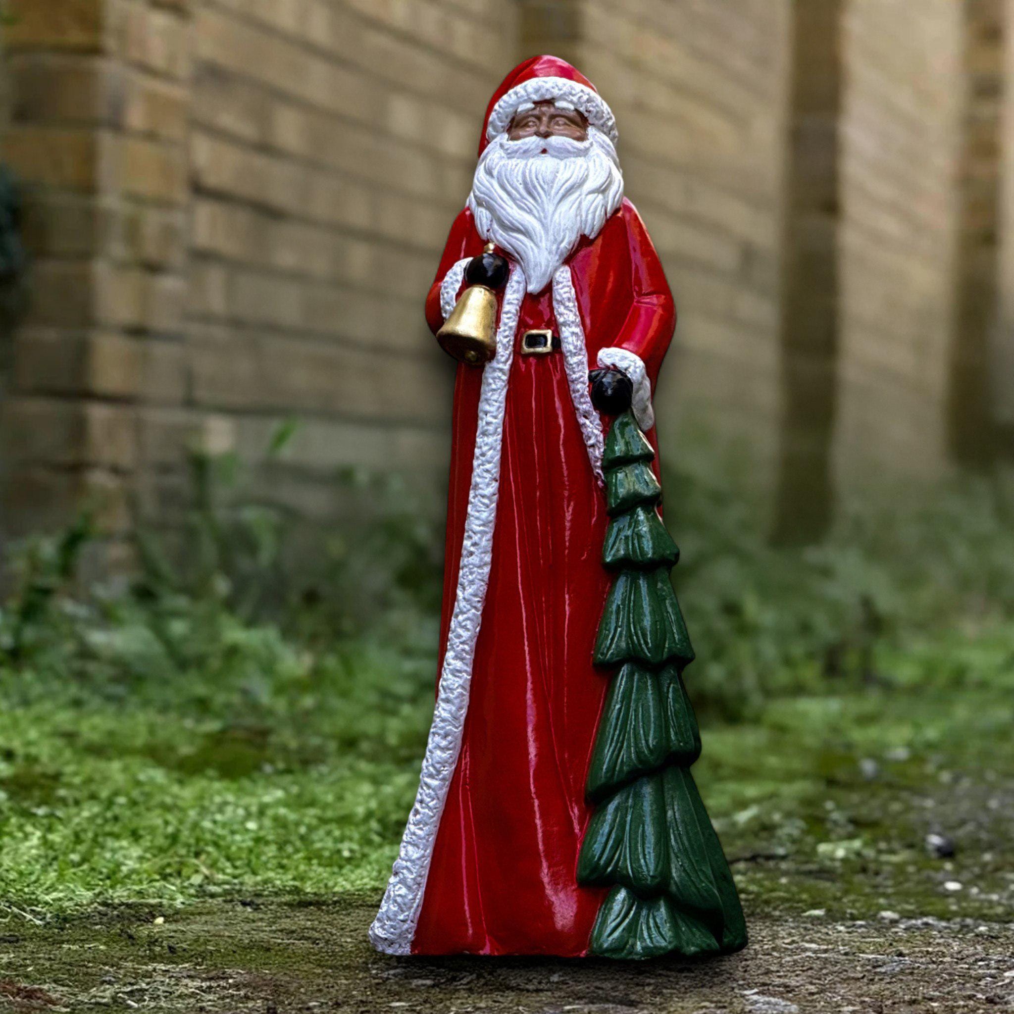 Outdoor santa claus statues