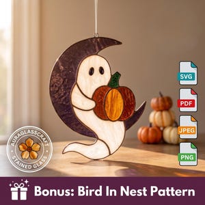 May include: A stained glass suncatcher featuring a white ghost holding an orange pumpkin, positioned in front of a dark purple crescent moon. The piece hangs from a thin string and includes digital file icons for SVG, PDF, JPEG, and PNG formats.