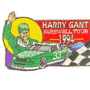 May include: Embroidered patch featuring a green race car with the number 33, a waving driver, and the text "HARRY GANT FAREWELL TOUR 1994". The patch has a checkered flag and mountain scene.