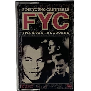 May include: A black cassette tape with a gold border. The tape features a black and white photo of three men. The text "Fine Young Cannibals" and "FYC" are in red and gold. The text "The Raw & The Cooked" is in gold.