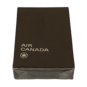 May include: A brown box with the text "AIR CANADA" and a maple leaf logo.