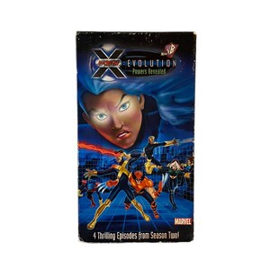 May include: A VHS tape featuring the X-Men Evolution cartoon series. The cover features Storm, Wolverine, Cyclops, and Nightcrawler. The title is "X-Men Evolution: Powers Revealed" and the text "4 Thrilling Episodes from Season Two!" is at the bottom.