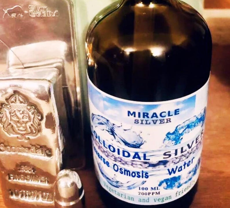 May include: A brown glass bottle with a white label that reads "Miracle Silver Colloidal Silver Reverse Osmosis Water 100 ML 200PPM Vegetarian and vegan friendly".