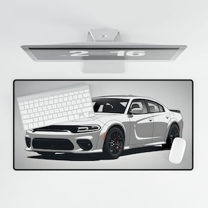 May include: A white Dodge Charger with black accents on a gray desk mat. A white keyboard and mouse are also on the desk mat.