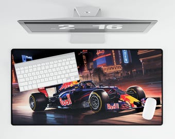 May include: A black and red Formula One race car with the Red Bull logo on the side, driving on a city street at night. The car is in focus, and the city lights are blurred in the background. A white wireless mouse is on the right side of the image.