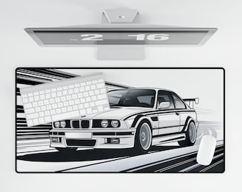 May include: A black and white illustration of a white BMW E36 on a black and white racing track. The car is facing the right side of the image. The image is on a black and white desk mat.