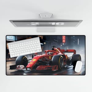 May include: A red race car with black wheels and a black spoiler is driving on a city street at night. The car is in focus, and the background is blurred. The car is a Ferrari.