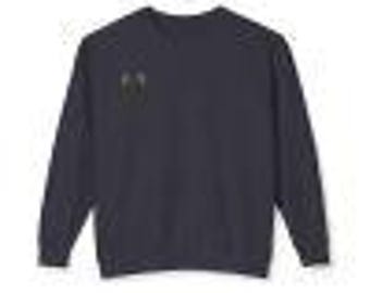May include: A dark navy blue long-sleeved sweatshirt with a small black and white graphic on the left chest.