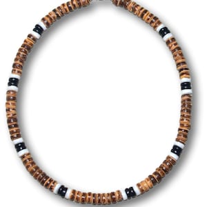 May include: A brown wooden beaded necklace with black and white accents. The necklace is made of small, round beads and has a silver clasp.