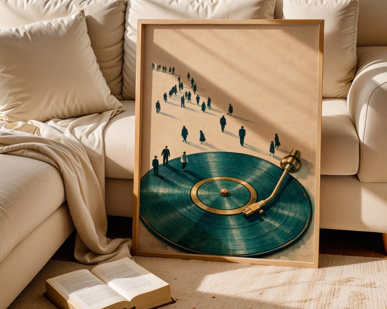 May include: A framed art print featuring a teal vinyl record with a gold tone needle and center. Silhouetted figures walk along a path towards the record. The artwork is displayed in a light wood frame.