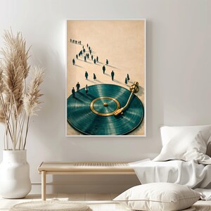 May include: Art print featuring a teal vinyl record with a gold tone center and arm. Small figures walk towards the record. The artwork is framed in white and hangs above a wooden bench and white pillows.