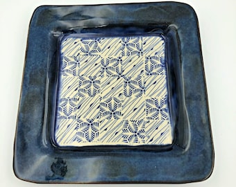 Handbuilt ceramic plate with a patchwork center and luscious blue rim