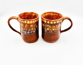 Handmade  coffee mug with yummy drippy glazes  Flowing butterscotch and brown glazes with a surprise of blue.