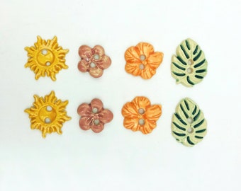 Fun handmade ceramic buttons in leaf, flower and sun shapes, made of white stoneware,  set of 2