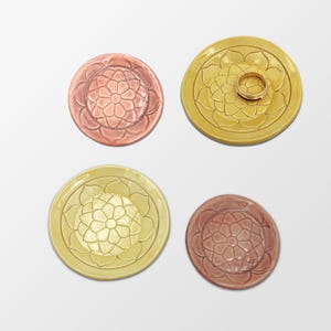 Wonky, colorful assortment of ceramic ring dishes, tea bag plates, tiny dishes or just whatever dishes