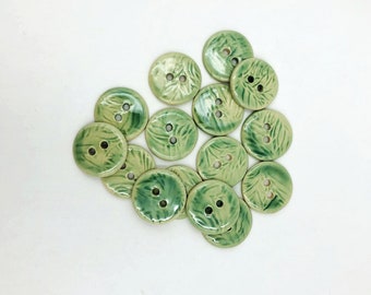 Set of 3 handmade ceramic buttons in off-white stoneware, with soft green glaze and random leaf texture