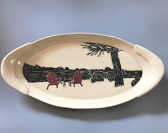 Hand carved, hand painted, hand built, ceramic platter with a pair of Adirondack chairs awaiting you