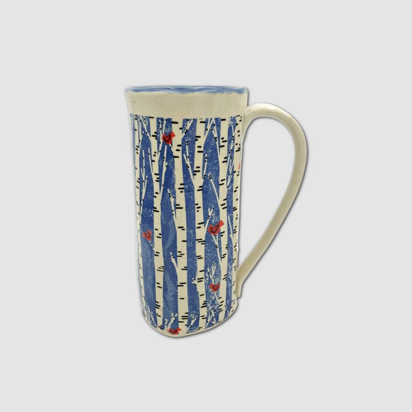 Handmade coffee or tea mug with birch trees and red cardinals, deep blue glaze inside. Embrace the wonkiness.