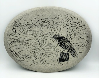 Unique raw granite wall hanging with black satin silkscreened topo map and Corvid. The only glaze is the black, the background is unglazed