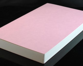 May include: A pink box with a white border. The box is made of cardboard and has a smooth surface.