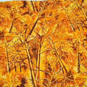 May include: A fabric print featuring a repeating pattern of stylized trees with branches in shades of orange, yellow, and brown. The background is a light yellow color.