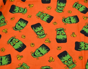 Halloween Fabric - Frankenstein Heads on Orange - Cotton Half Yard