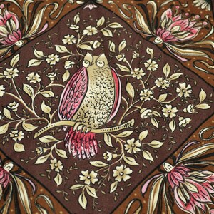 May include: A brown fabric textile featuring a repeating diamond pattern. Each diamond contains a central illustration of an owl perched on a branch surrounded by small white flowers. The corners feature large pink and cream floral motifs.