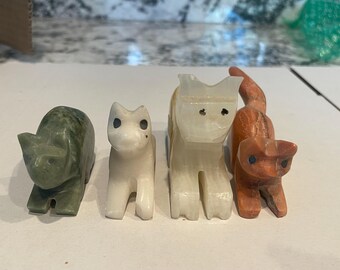 4 Vintage stone kitties, collected around the world by a prolific traveler.  Two marked Athens and Marrakesh, two unmarked - sold as a set.