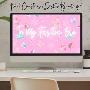 May include: A pink computer desktop background with a Christmas theme. The background features a pink background with white snowflakes, candy canes, and Christmas trees. The text "In My Festive Era" is written in white on the background.