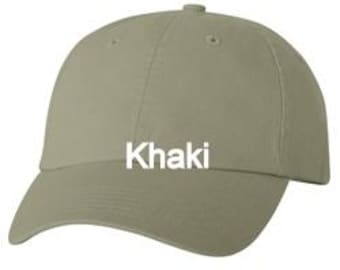 May include: A solid olive-toned baseball cap featuring a structured six-panel design with a curved brim and a button top. The word Khaki is printed in bold white sans-serif letters across the center front of the crown.