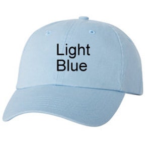 May include: A light blue baseball cap with a structured crown and a curved brim. The front of the cap features the text Light Blue printed in a simple black sans-serif font. The cap includes a button on the top and stitched eyelets.