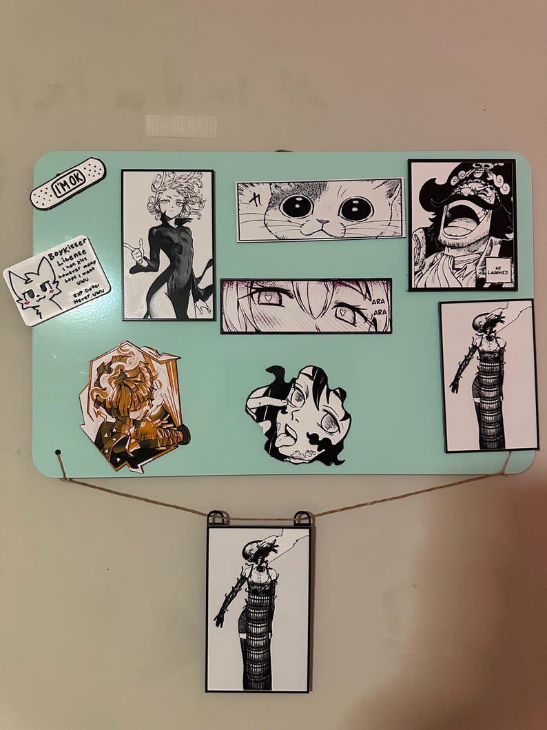 A grid arrangement of eight magnets and one orange/black sticker displayed on a stainless steel refrigerator. The collection features black and white manga panels of the Bomb Devil (Reze), Gol D. Roger, Tatsumaki, a cat face, a pair of eyes with "ARA ARA," a 'Boykisser License' meme, and a character with the quote, "LET ME SEE YOUR POTENTIAL."