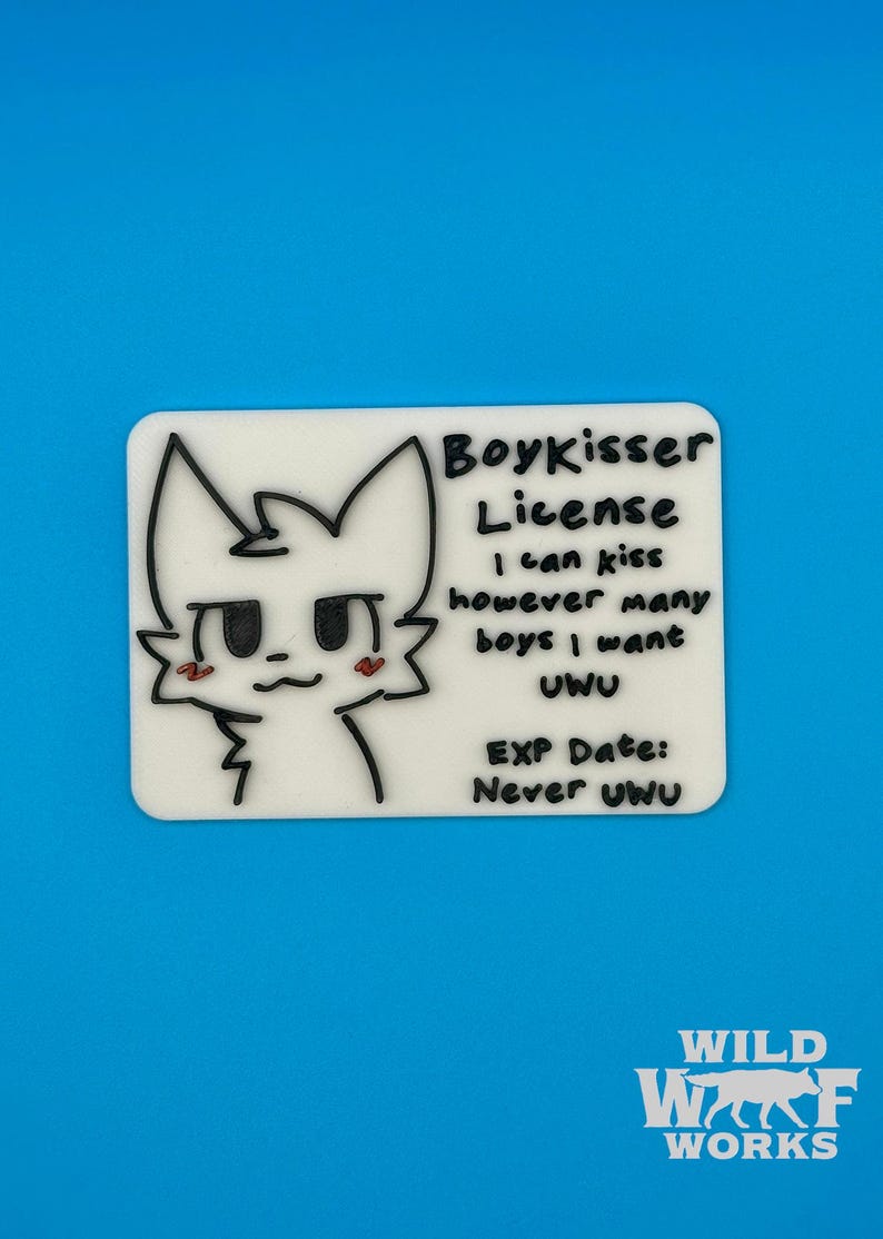 Close-up of the Boykisser License charm on a plain white background, showing the white license with black text and line art of the character with pink blush marks.