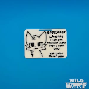 The Boykisser License charm displayed on a solid blue background, with the "WILD WOLF WORKS" logo in the bottom right corner.