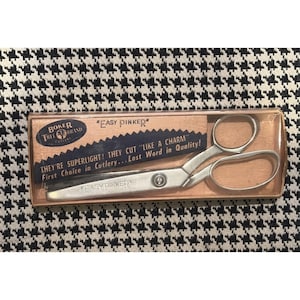 May include: A set of three ceramic mugs with a speckled, matte finish. The mugs are in shades of cream, light grey, and dark grey. Each mug has a simple, minimalist design, ideal for coffee or tea.