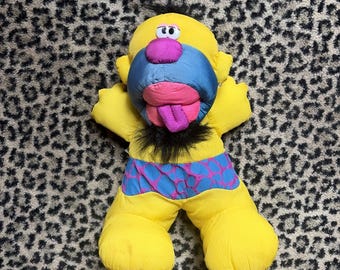 Puffalump 1992 Fisher Price, Rocky Caveman Yellow Plush Grunts squeezed Works!