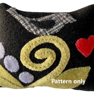 Speldenkussen met merel en bessenpatroon