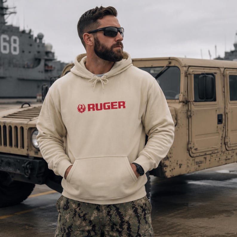 Gear up in this tan Ruger logo hoodie, built for comfort and rugged style. Perfect for range days, outdoor missions, or casual wear. Pairs seamlessly with camo pants, tactical boots, or jeans. A durable fleece essential for gun owners, military supporters, and outdoor enthusiasts who live the 2A lifestyle with pride.