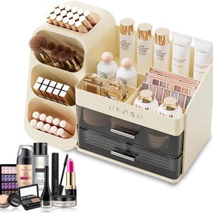 May include: A beige and black makeup organiser with multiple compartments and drawers. The organiser holds various cosmetics, including brushes, lipsticks, bottles, and eyeshadow palettes. The word "UFORU" is printed on the front.