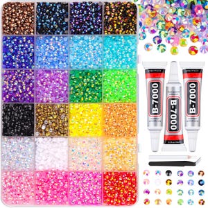 May include: A rectangular storage container with twenty-four compartments filled with small, multi-colored faceted rhinestones. Included are three tubes of B-7000 adhesive, a white wax pencil, a pair of black tweezers, and loose iridescent crystals.