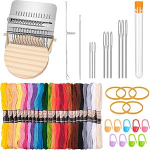 May include: A craft kit featuring a silver metal weaving loom, wooden circles, needles, and colourful embroidery floss. Includes orange rubber bands and stitch markers in various colours. The kit is designed for crafting and textile projects.