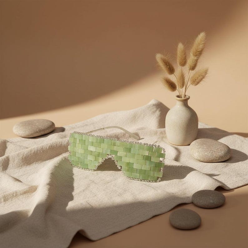 Cooling or warming jade eye mask made from 100% real jade beads. Reduces puffiness, soothes tension, boosts circulation, and brings calm, balance, and radiant renewal.