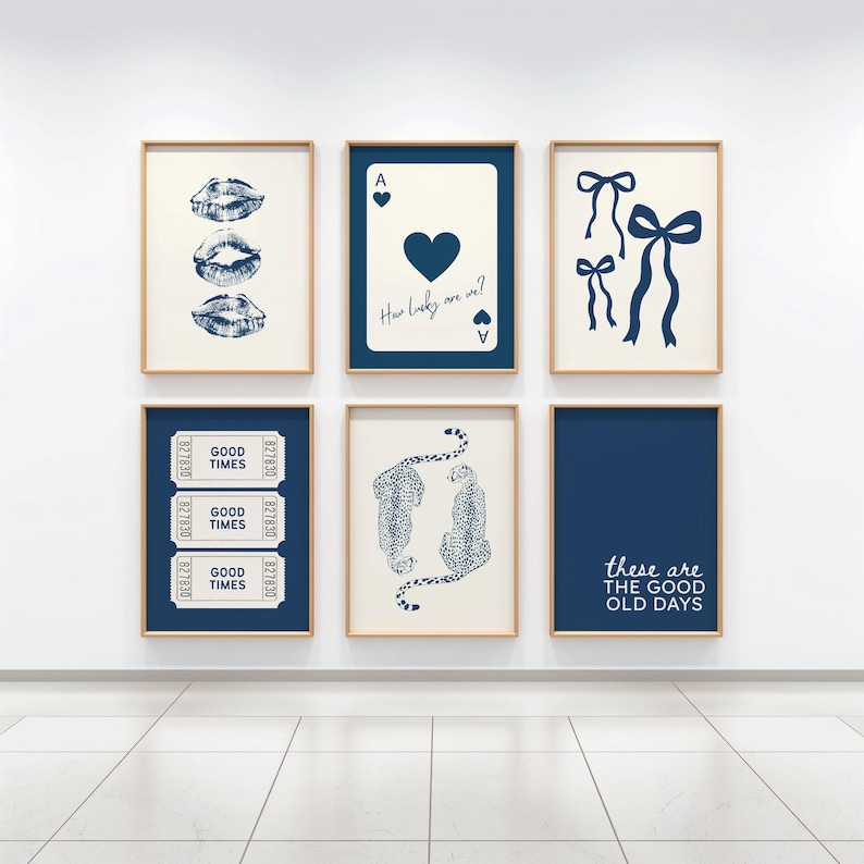 May include: Six framed prints with a minimalist design. The prints feature images of lips, playing cards, bows, tickets, cheetahs, and text that reads "these are the good old days." The color scheme is navy blue and beige.