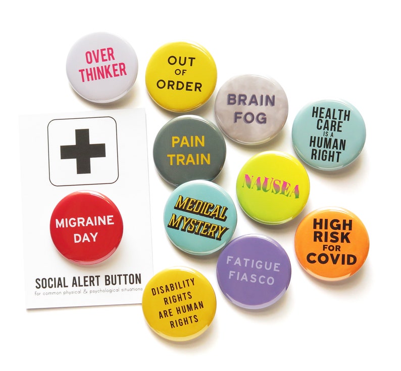 May include: A set of 12 round button badges with various phrases and designs. The badges are colorful and feature phrases like "Over Thinker", "Out of Order", "Pain Train", "Brain Fog", "Nausea", "Medical Mystery", "Fatigue Fiasco", "High Risk for COVID", "Health Care is a Human Right", "Disability Rights are Human Rights", and "Migraine Day".