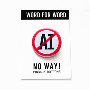 A round white pinback button with a red outline circle-and-slash graphic over the letters 'AI' in black text, indicating the wearer is against AI, or artificial intelligence.  The button is displayed on a white card with black text that reads 'WORD FOR WORD' at the top and 'NO WAY! PINBACK BUTTONS' at the bottom.