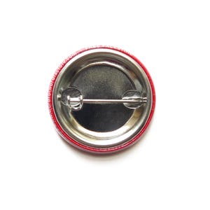 Back of metal pinback button.